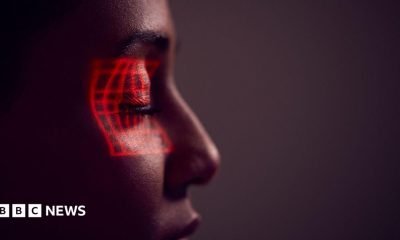 Facial Recognition Technology Concept As Woman Has Red Grid Projected Onto Eye In Studio