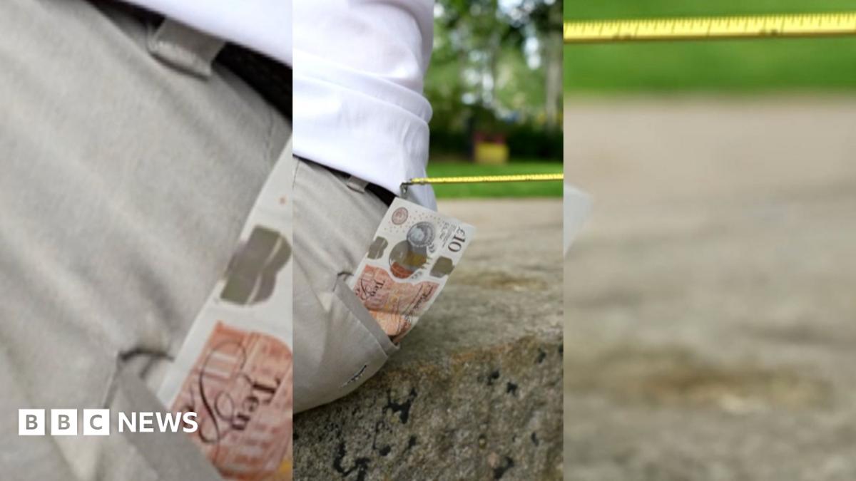A £10 note sticking out of someone's back pocket with a tape measure attempting to steal it.
