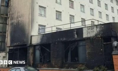 The front of a hotel damaged by fire.