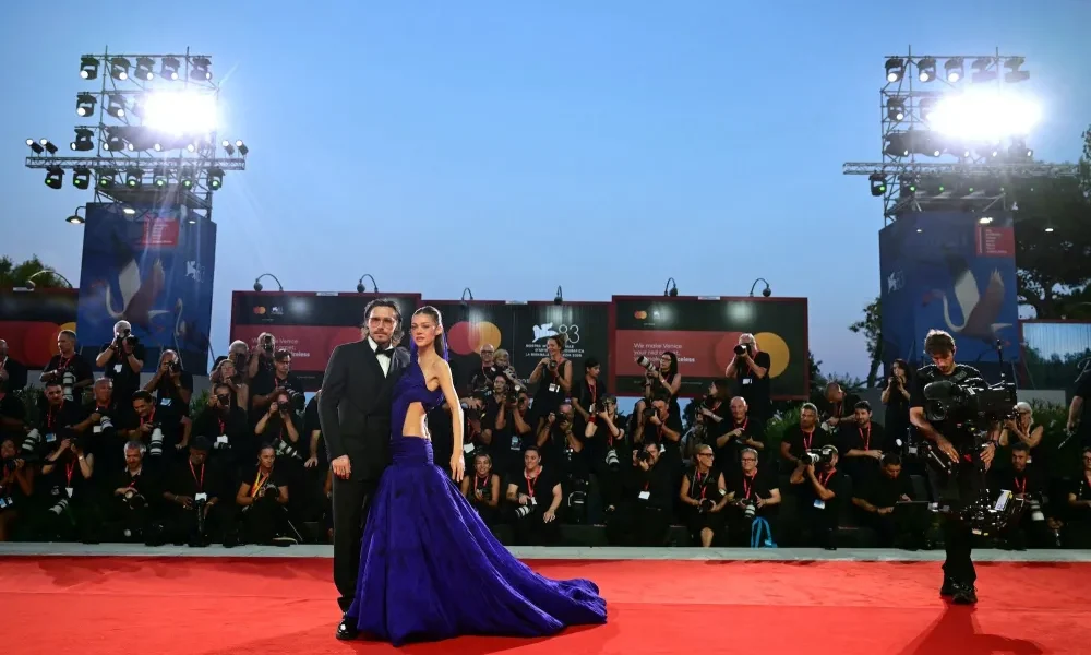 GettyImages-2293192850 Brooklyn Beckham and Wife Nicola Peltz Pack on the PDA on Venice Film Festival Red Carpet