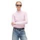 A woman wearing a light pink sweater, sunglasses, a black belt, and blue jeans