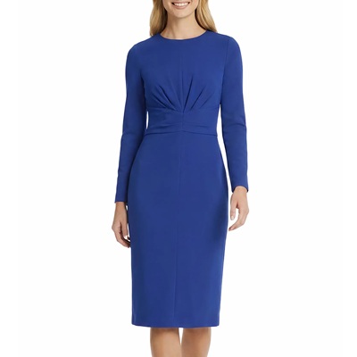 A woman wearing a bright blue sheath dress