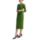A woman wearing a green dress and black pumps