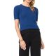 A woman wearing a medium blue short-sleeved sweater and black pants
