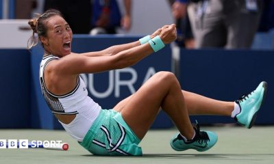 Qinwen Zheng falls to the ground in celebration after beating Madison Keys
