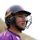 Robin Das wearing a black cricket helmet, carrying a cricket bat and wearing a purple top