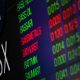 Aussie shares limp across the line to end volatile week