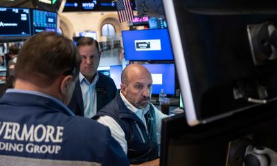 Wall Street closes lower as oil prices increase