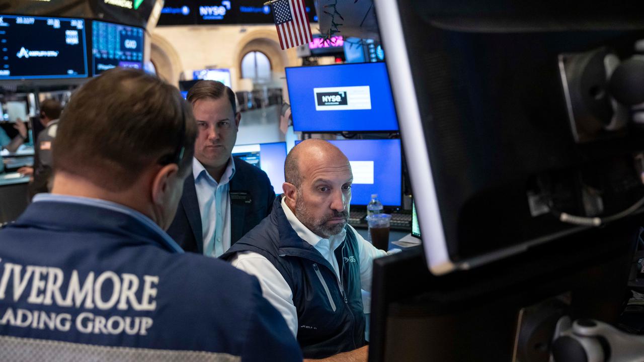 Wall Street closes lower as oil prices increase