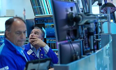 Wall Street ends mixed after tumultuous week