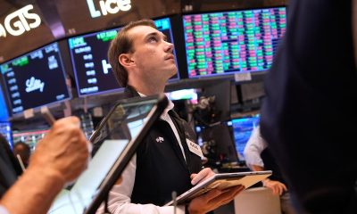 Wall St closes higher as oil eases, Treasury yields dip
