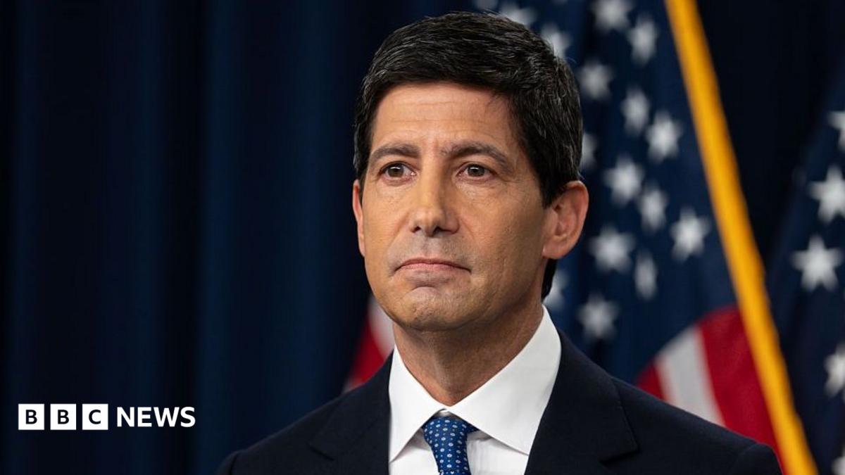 Kevin Warsh, chairman of the Federal Reserve, taking questions at a press conference in Washington DC on 16 September. He is wearing a dark navy blue suit with a white shirt and blue-spotted tie.