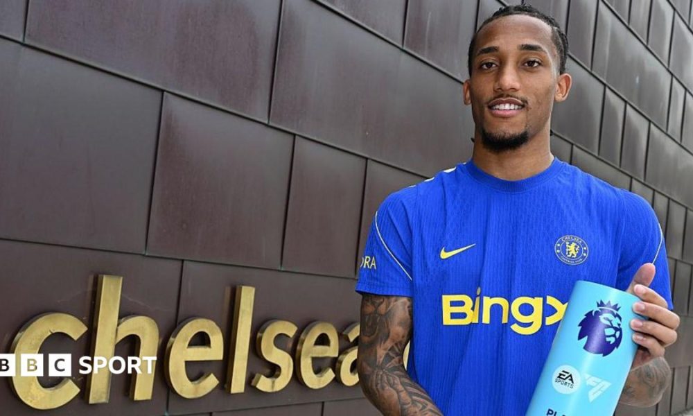 Joao Pedro holding his Player of the Month award