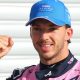 Alpine's Pierre Gasly poses with a picture of the '1' board after taking pole position at the Italian Grand Prix