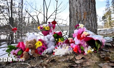 Flowers and toys lie on the ground near the site of a mass shooting at a high school, in the town of Tumbler Ridge, British Columbia, Canada February 11.