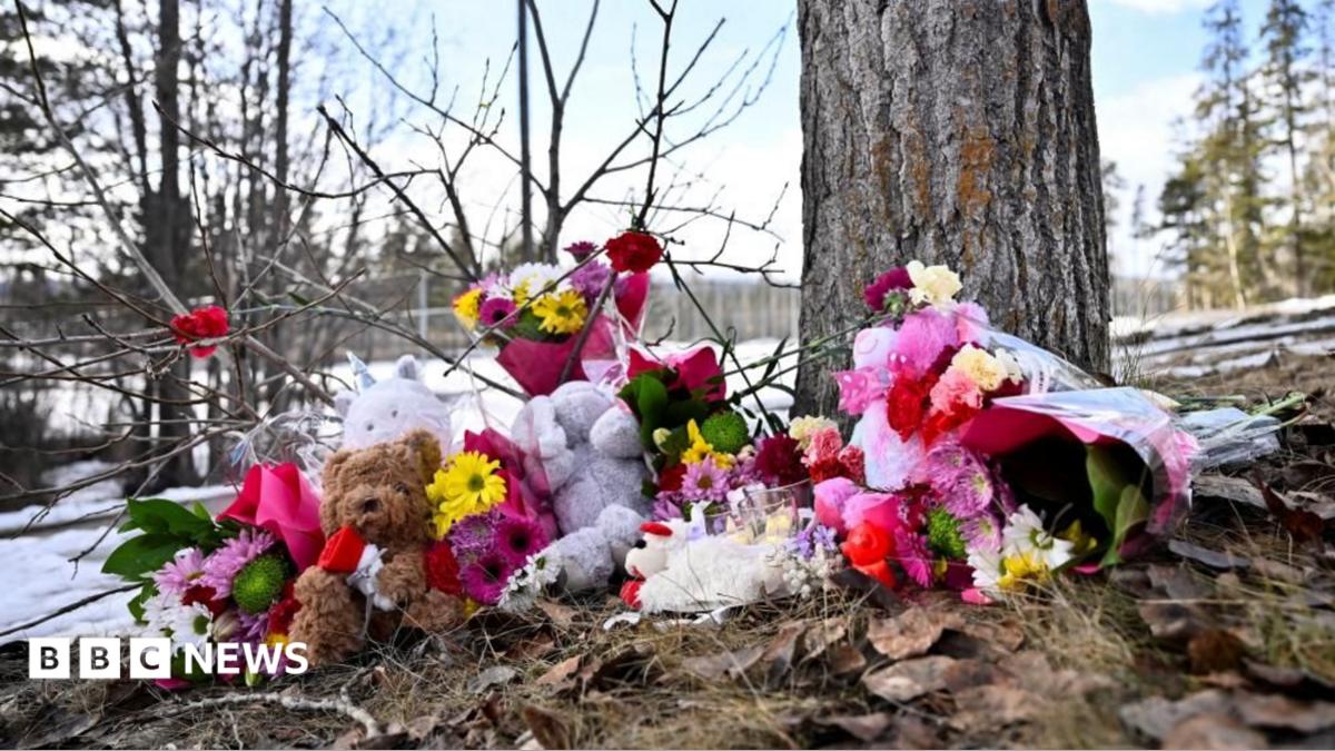 Flowers and toys lie on the ground near the site of a mass shooting at a high school, in the town of Tumbler Ridge, British Columbia, Canada February 11.