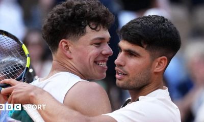 Ben Shelton and Carlos Alcaraz hug after their 2025 French Open match