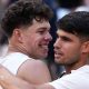 Ben Shelton and Carlos Alcaraz hug after their 2025 French Open match