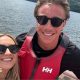 Molly and Taylor Haylett on a boat in the water smiling