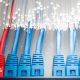Two workers in hi-vis jackets work with bundles of cabling at a data centre project
