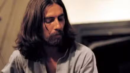 bearded-george-harrison-turning-to-his-right-in-george-harrison-living-in-the-material-world