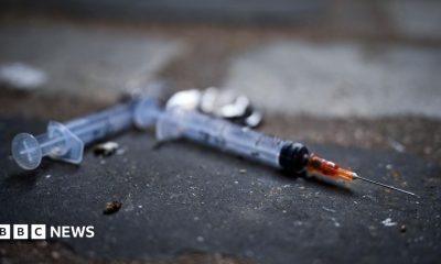 Needles littering the pavement in a lane in Glasgow