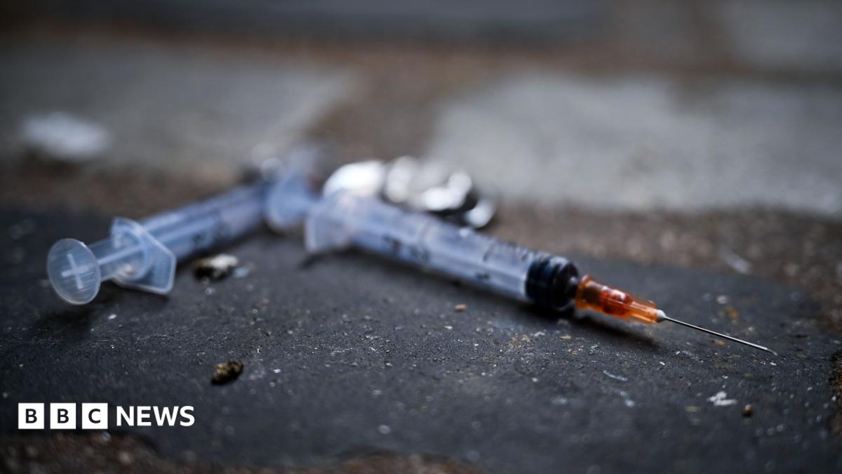 Needles littering the pavement in a lane in Glasgow