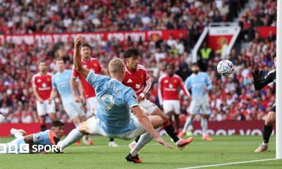 Manchester City striker Erling Haaland scores against Manchester United