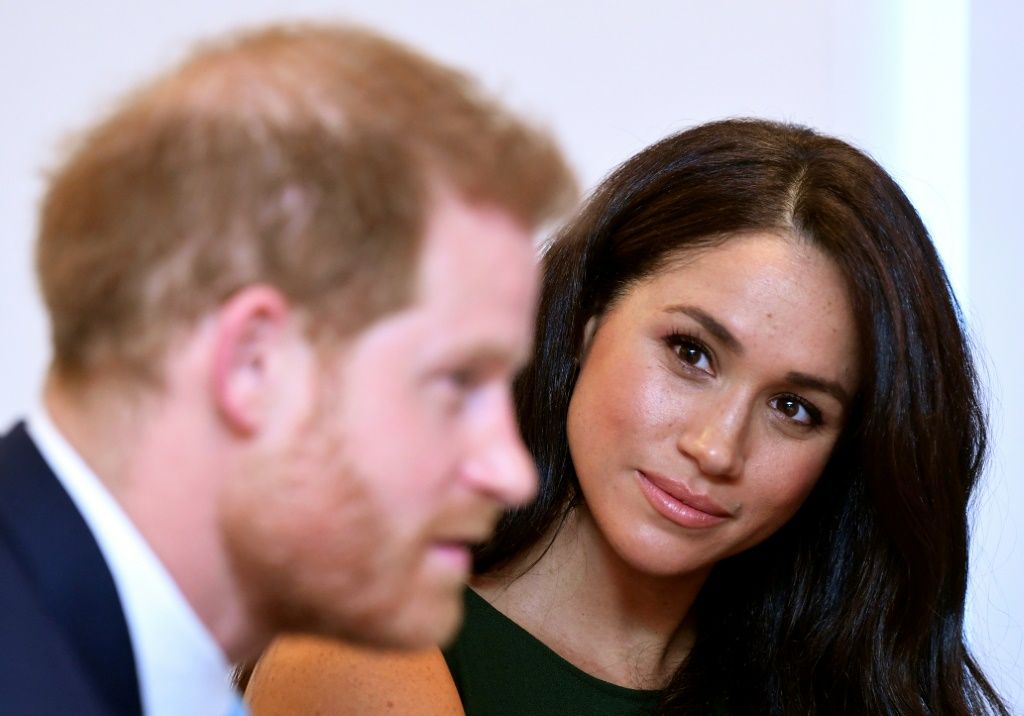 Britain's Prince Harry and his wife Meghan Markle are pictured.
