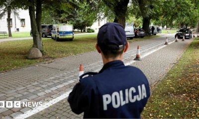 A police officer stands guard near the site of a knife attack on the grounds of a Catholic abbey in Jarosław, south-eastern Poland. Photo: 24 September 2026