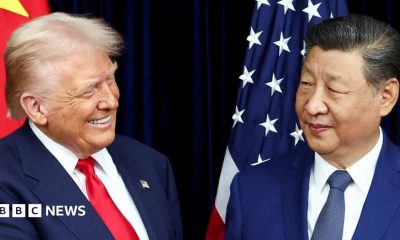 US President Donald Trump and Chinese leader Xi Jinping exchange smiles as they greet each other before a meeting.