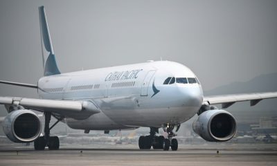 Cathay Pacific warned of a tough road ahead after reporting a record loss for 2020