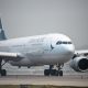 Cathay Pacific warned of a tough road ahead after reporting a record loss for 2020