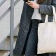 Close up of stylish woman carrying canvas tote bag