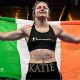 Katie Taylor holds the Ireland flag over her shoulders
