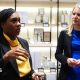Conservative leader Kemi Badenoch and shadow culture secretary Rebecca Paul visit a shop in Bicester Village. Behind them are shelves with toiletries and candles.