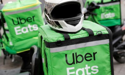 Delivery bags with logos of Uber Eats are seen on a street in central Kiev