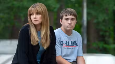Linda Cardellini as Carol with Arlan Ruf as her son Richard sitting side by side in DTF St. Louis