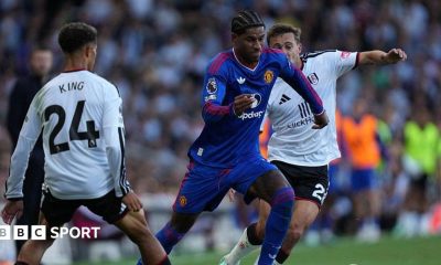 Manchester United's Marcus Rashford tries to beat Fulham pairTimothy Castagne and Josh King