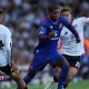 Manchester United's Marcus Rashford tries to beat Fulham pairTimothy Castagne and Josh King