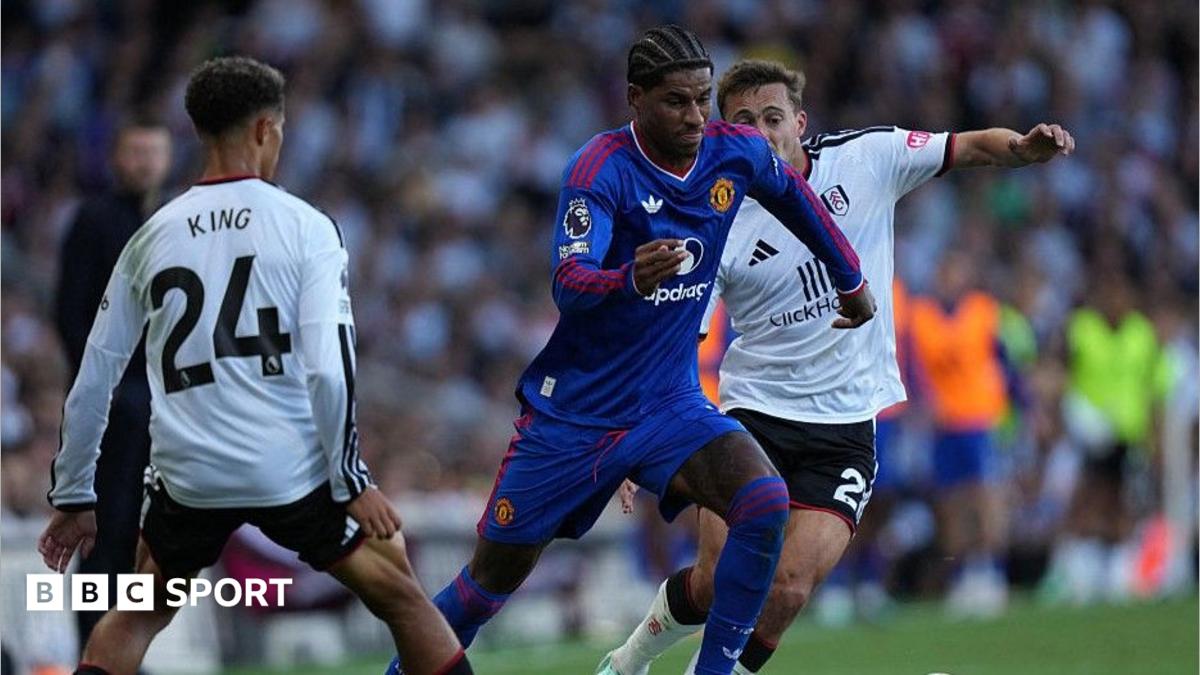 Manchester United's Marcus Rashford tries to beat Fulham pairTimothy Castagne and Josh King