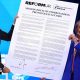 Reform UK leader Nigel Farage and National Rally President Jordan Bardella hold a large version of the proposed agreement