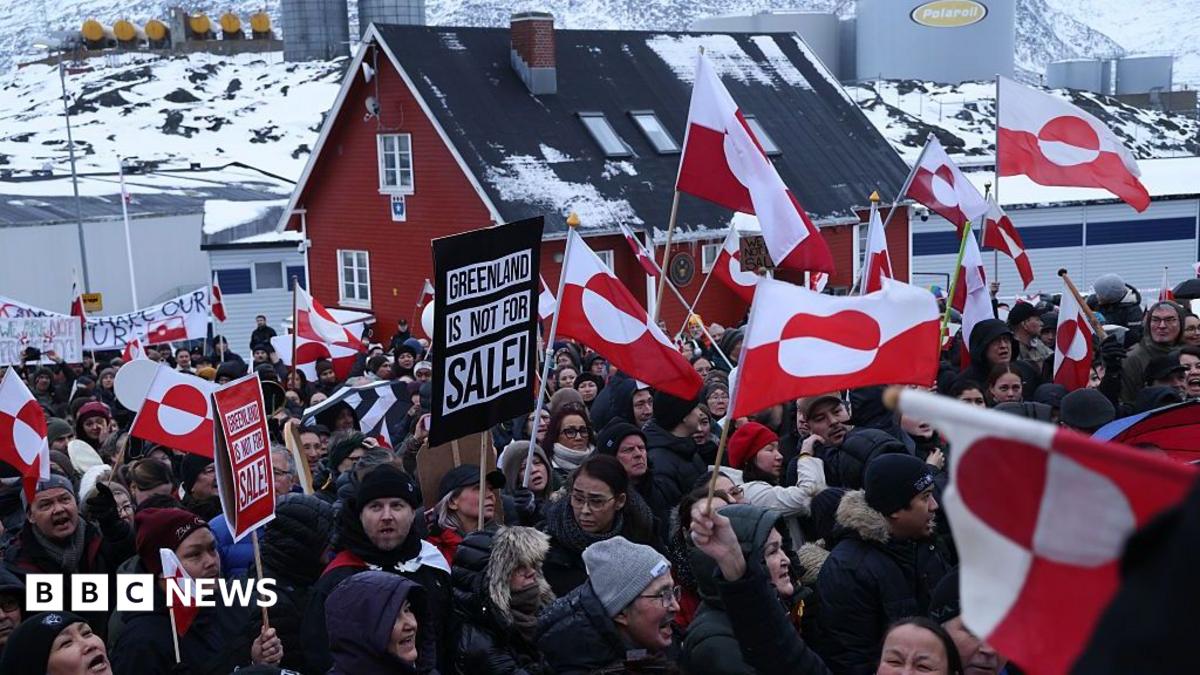 People bear Greenlandic flags as they gather in front of the US consulate in Nuuk, Greenland, in a protest against President Donald Trump's announced intent to acquire Greenland in January 2026