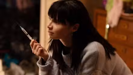 Lola Petticrew holding a syringe in Furious.