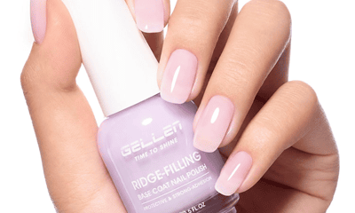 woman holds nail polish bottle from Gellen