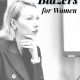 pinterest graphic reads THE ULTIMATE GUIDE TO BLAZERS FOR WOMEN; in the background a professional young woman in blazer has contemplative expression on her face; she is holding a piece of paper