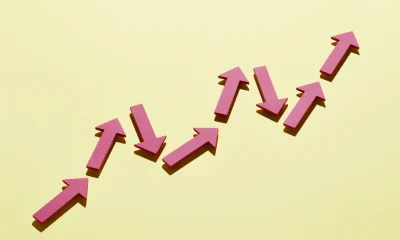 A group of arrows moving up together