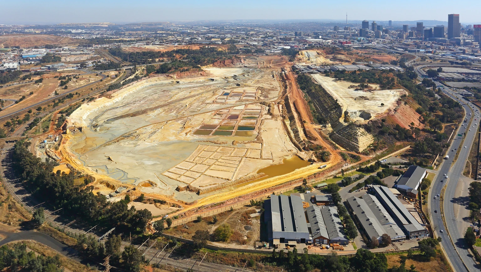 Aerial photo of a Johannesburg mine and CBD from a helicopter, Johannesburg