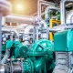 Interior view of an oil and gas petrochemical refinery plant with pipeline and valves. Industrial fuel production.