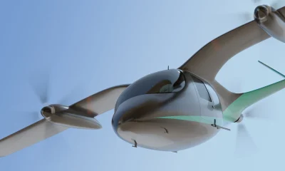Electric VTOL passenger aircraft flying in the sky